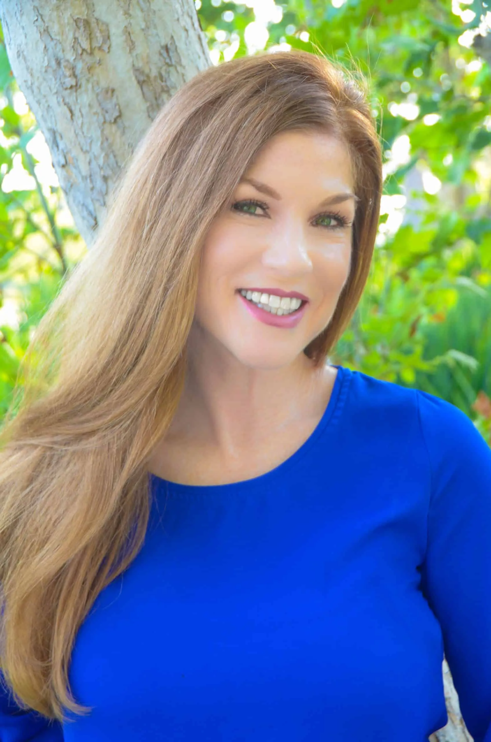 Dr. Tammy Bradshaw-Scott smiling outdoors in a blue shirt