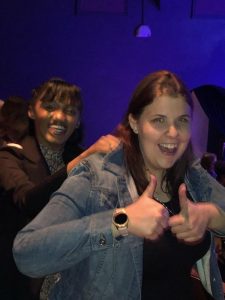 Happy woman giving thumbs up at Dr. Tammy Bradshaw-Scott event.